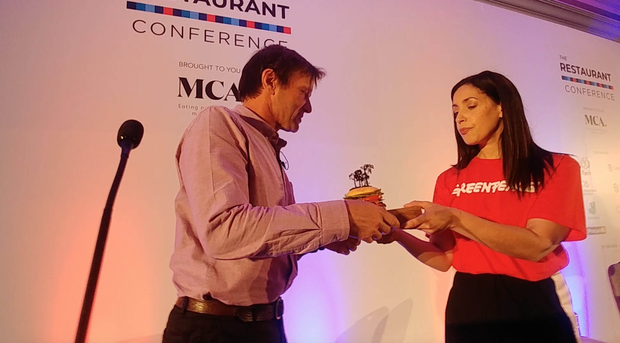 Greenpeace present Burger King UK CEO with award for flame-grilling The Amazon