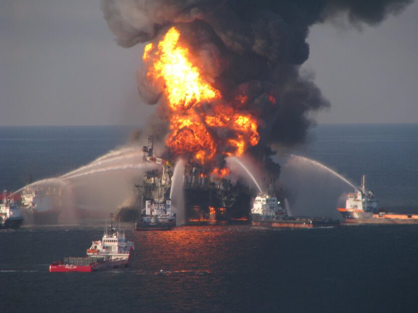 Fire response boats hosing water onto the burning deepwater horizon oil rig